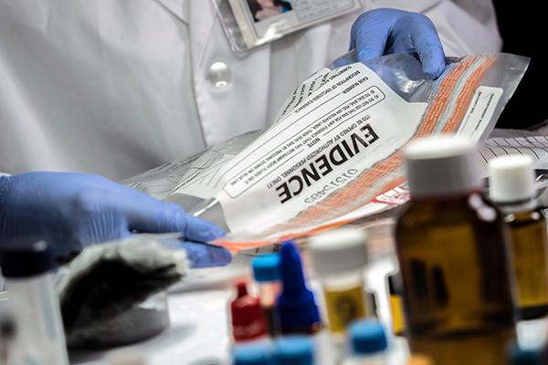 Evidence bag with evidence samples in a lab setting