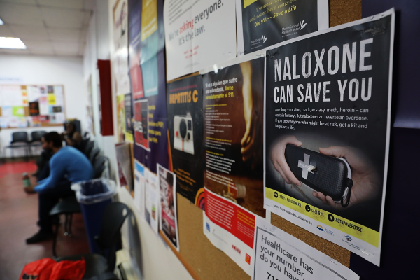 a naloxone poster on a pinboard