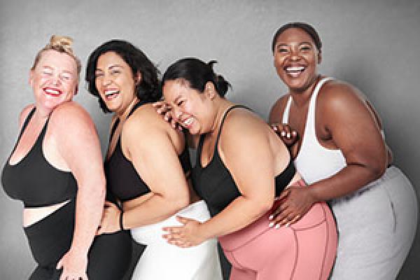 Four overweight female models of varying skin tones