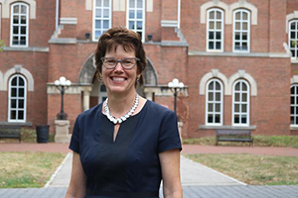 Dean Gretchen Ritter in front of University Hall