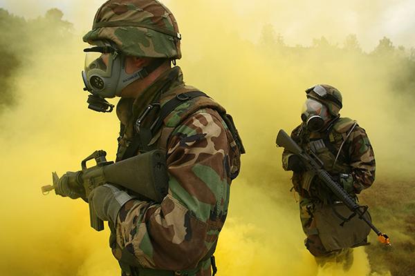 Soldiers training in yellow smoke