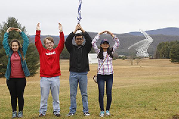 Students pose in O-H-I-O on the site of the Green Bank Telescope in Green Bank, West Virginia.