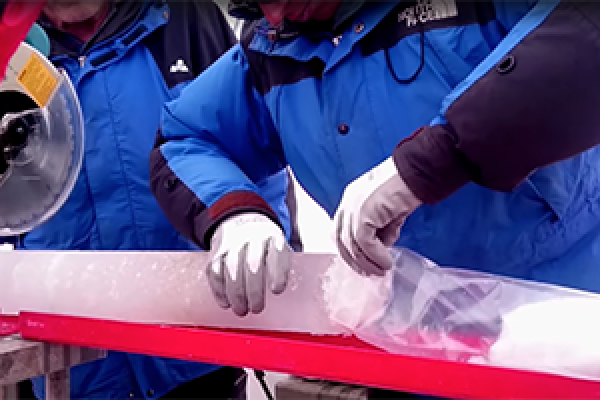 An ice core retrieved from the Guliya Ice Cap in the Kunlun Mountains in Tibet in 2015. Photo by Giuliano Bertagna, courtesy of the Byrd Polar and Climate Research Center.