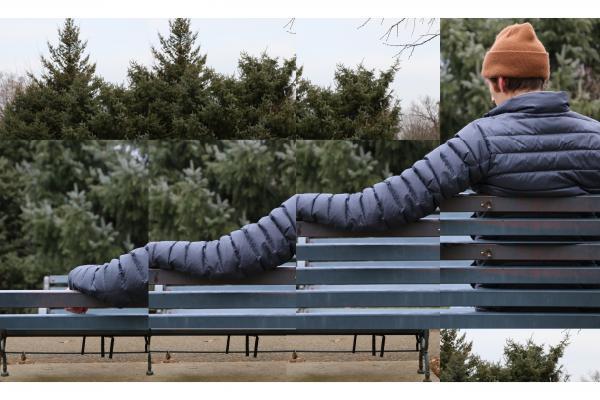Person sitting on bench outside