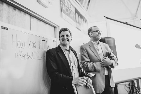 Associate professors Jesse Kwiek (left) of microbiology and Thomas McDow of history at the STEAM Factory for an event that concludes their co-taught course on HIV. Photo courtesy Paul Woo, Wandering Woo Photography