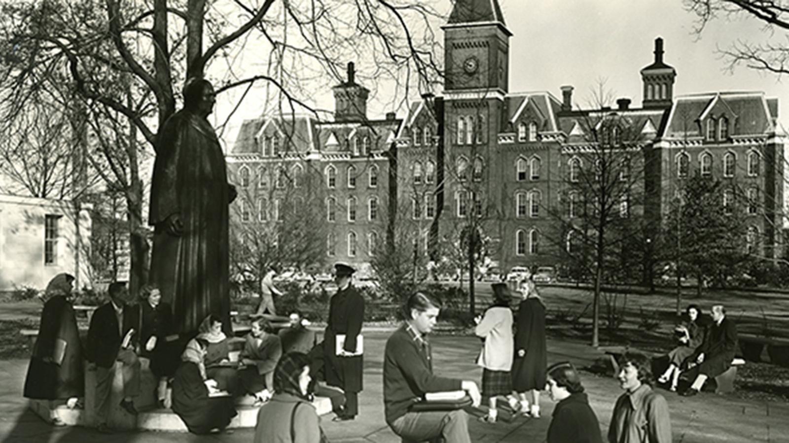 Students hanging out outside of University Hall in the 1940s
