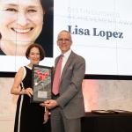 Lisa Lopez accepting her Distinguished Achievement Award from Dean Horn