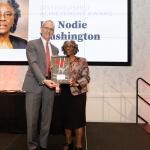Dr. Nodie Washington accepting her Distinguished Achievement from Dean Horn