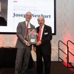 Joe Newhart accepting his Distinguished Service Award from Dean Horn