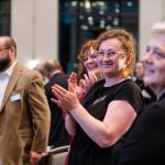 The College of Arts and Sciences Advancement staff applauding an award winner